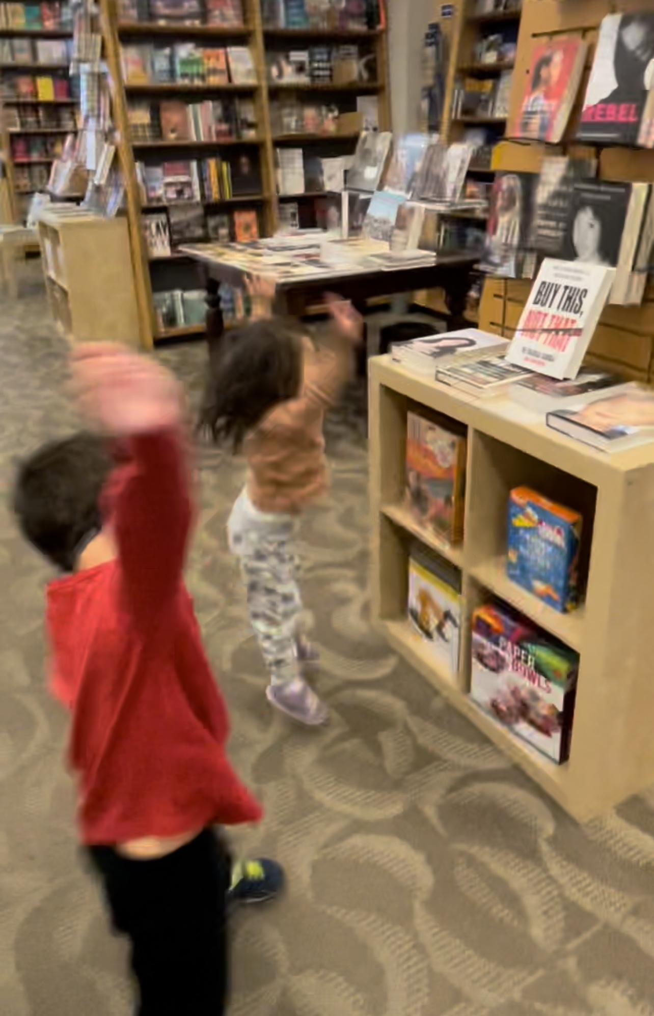 Hooray for daddy! Kids shouting once they found Buy This, Not That in the bookstore